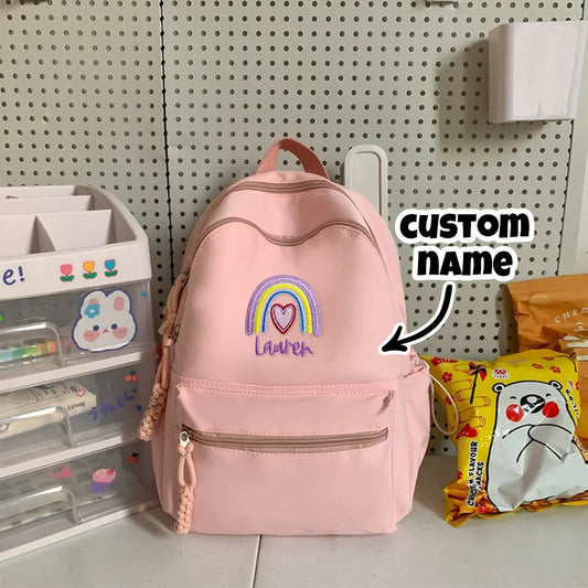 Personalized embroidered rainbow backpack with name, perfect school or back-to-school gift for kids.

