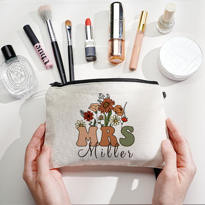 Custom canvas makeup bag with flower pencil design and name, ideal teacher gift.