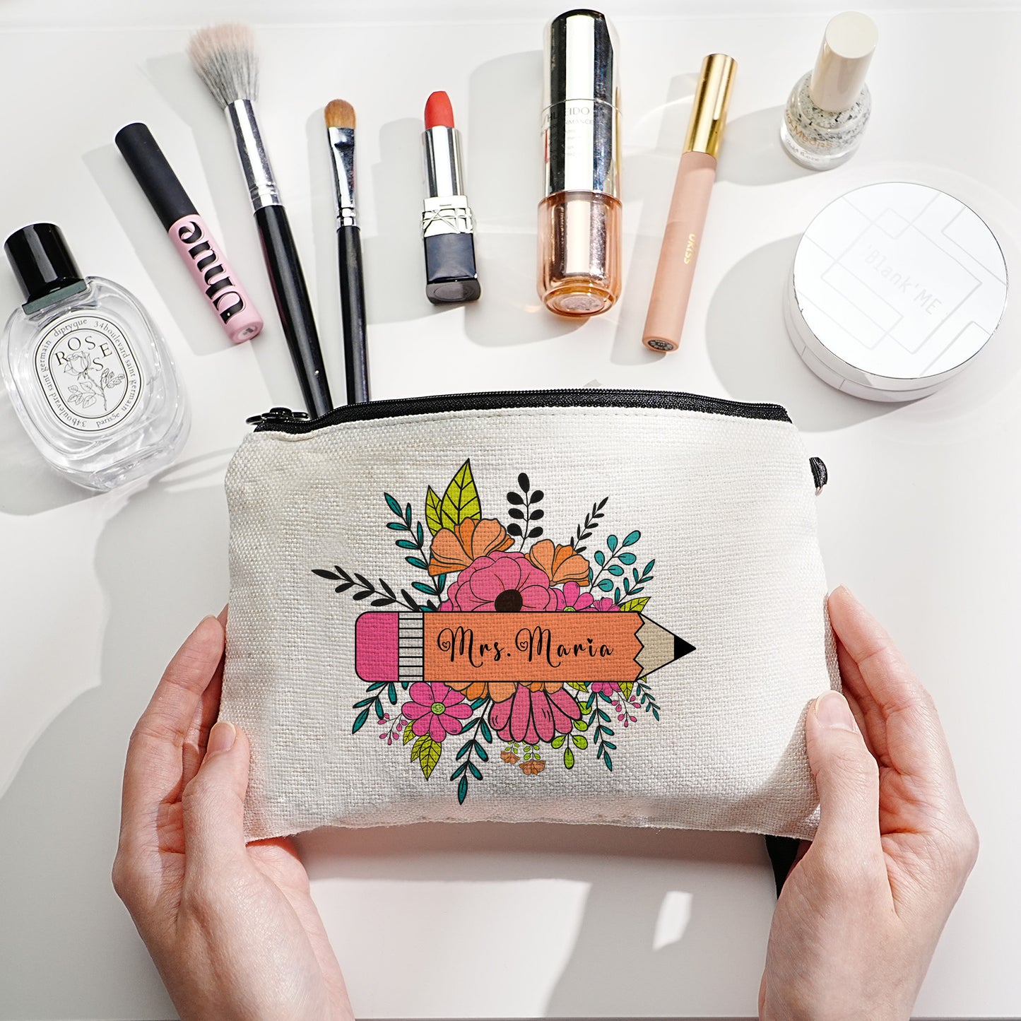 Custom canvas makeup bag with flower pencil design and name, ideal teacher gift.