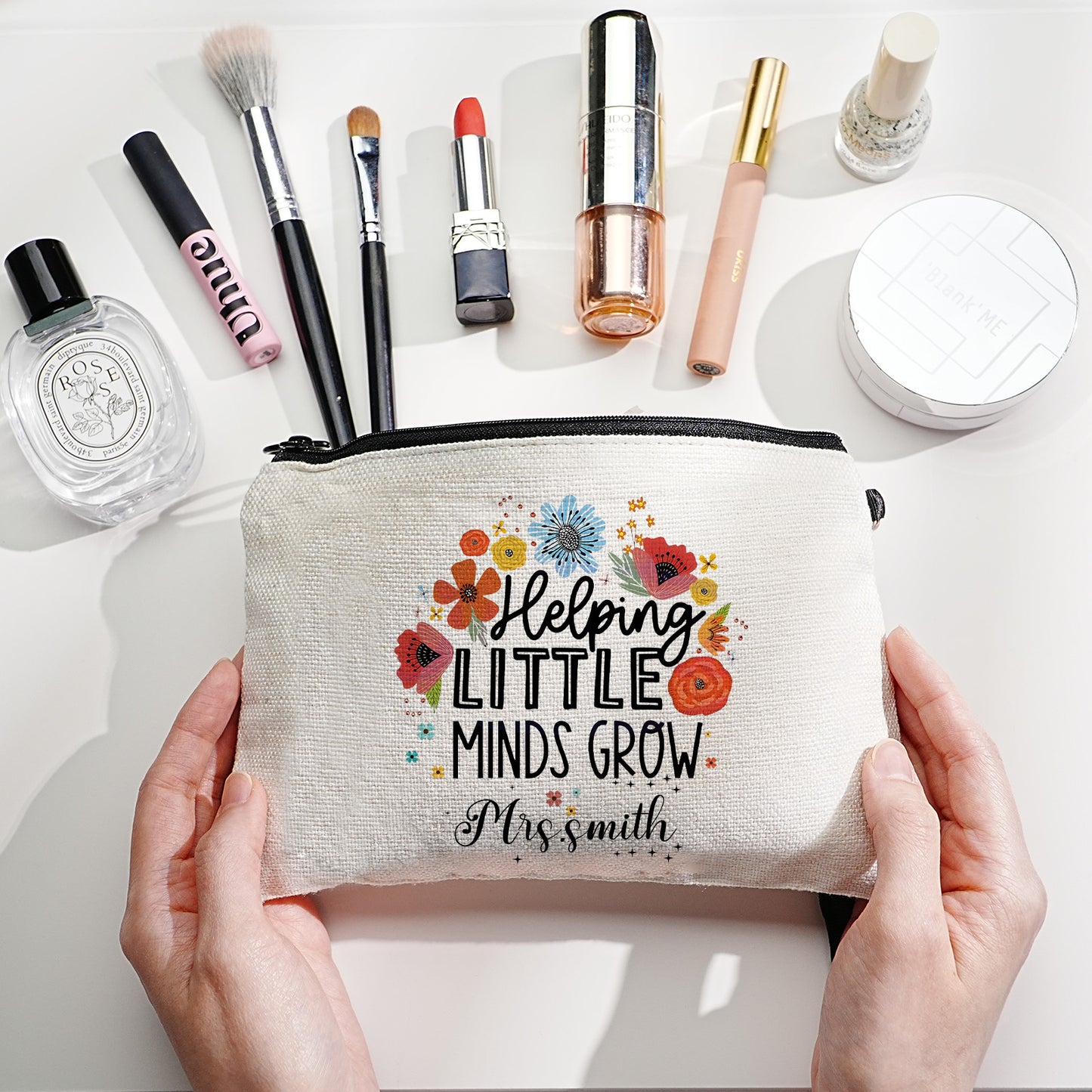 Custom canvas makeup bag with flower pencil design and name, ideal teacher gift.