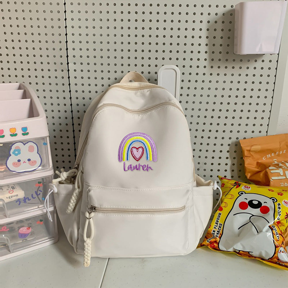 Personalized embroidered rainbow backpack with name, perfect school or back-to-school gift for kids.

