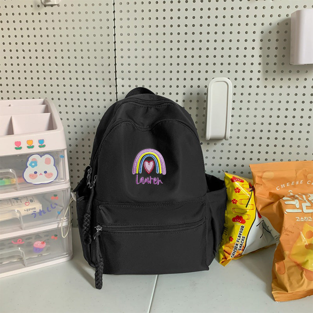 Personalized embroidered rainbow backpack with name, perfect school or back-to-school gift for kids.

