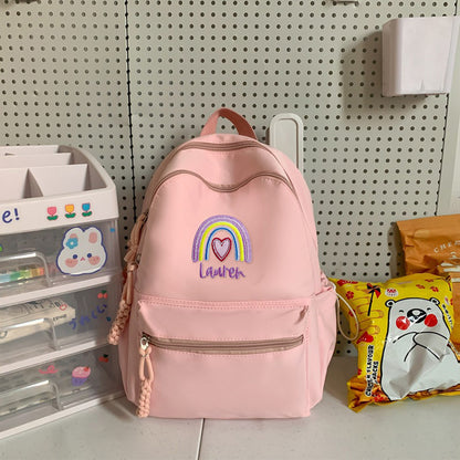 Personalized embroidered rainbow backpack with name, perfect school or back-to-school gift for kids.

