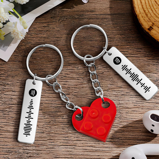 Personalized Spotify code matching heart keychain for couples.