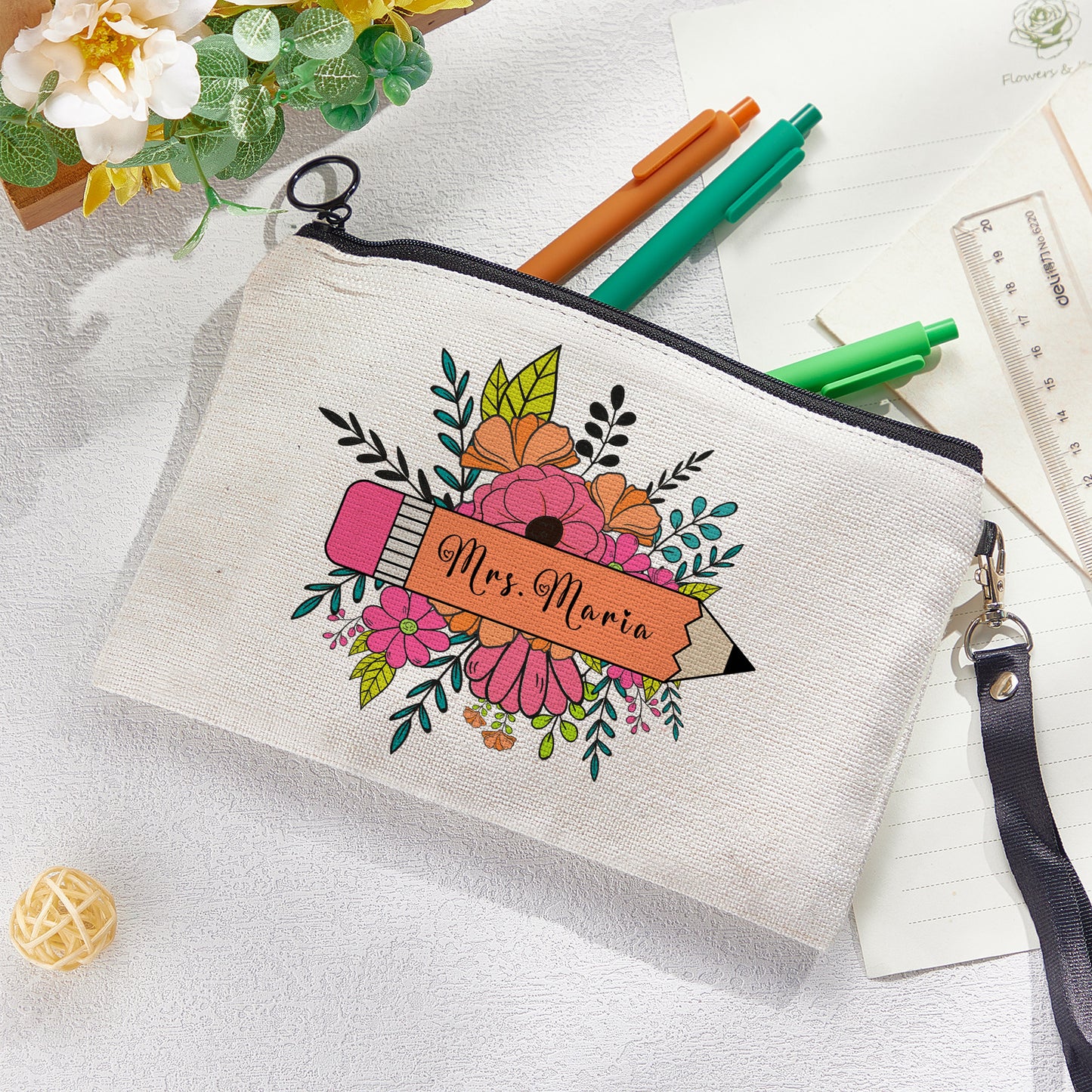 Custom canvas makeup bag with flower pencil design and name, ideal teacher gift.