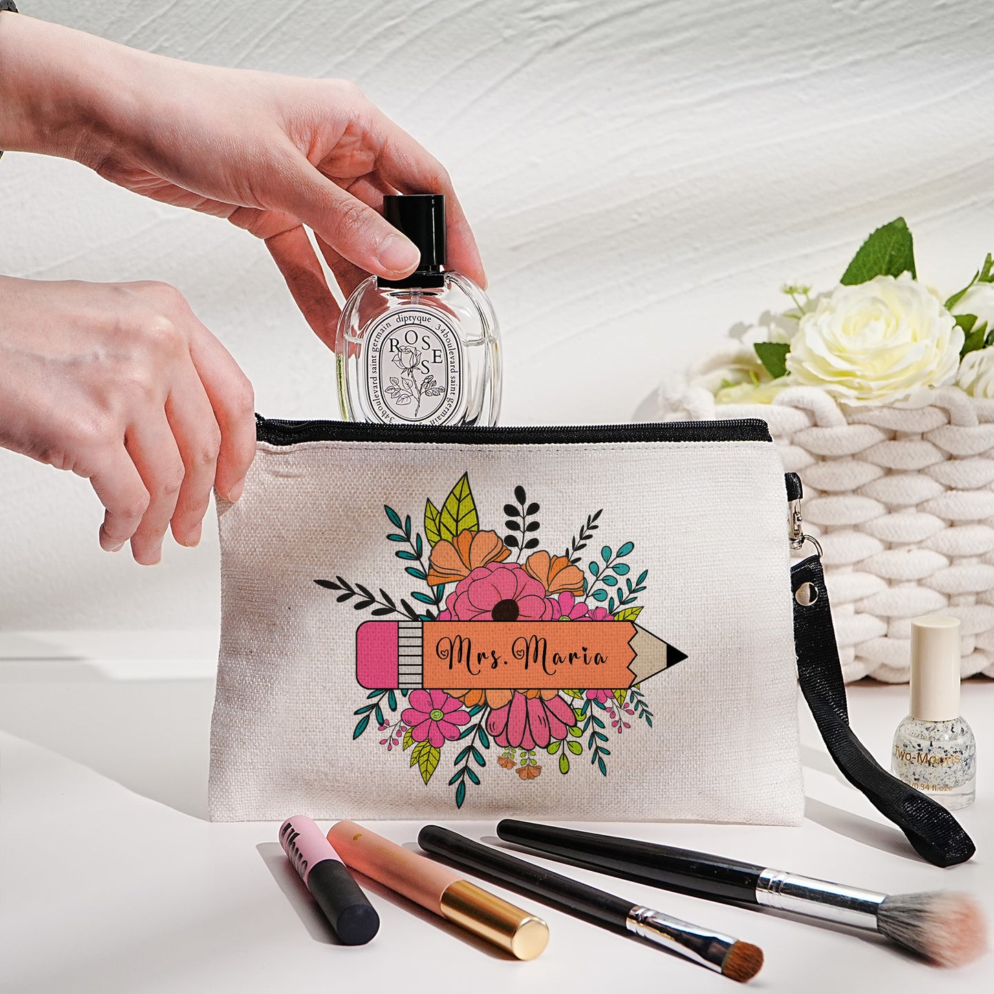 Custom canvas makeup bag with flower pencil design and name, ideal teacher gift.